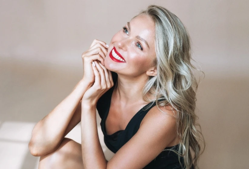 blonde woman smiling with red lipstick | Ingram Cosmetic Surgery Nashville